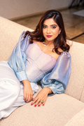 Woman wearing The Opaline Corset by Kashié, a pastel ombre organza silk corset top