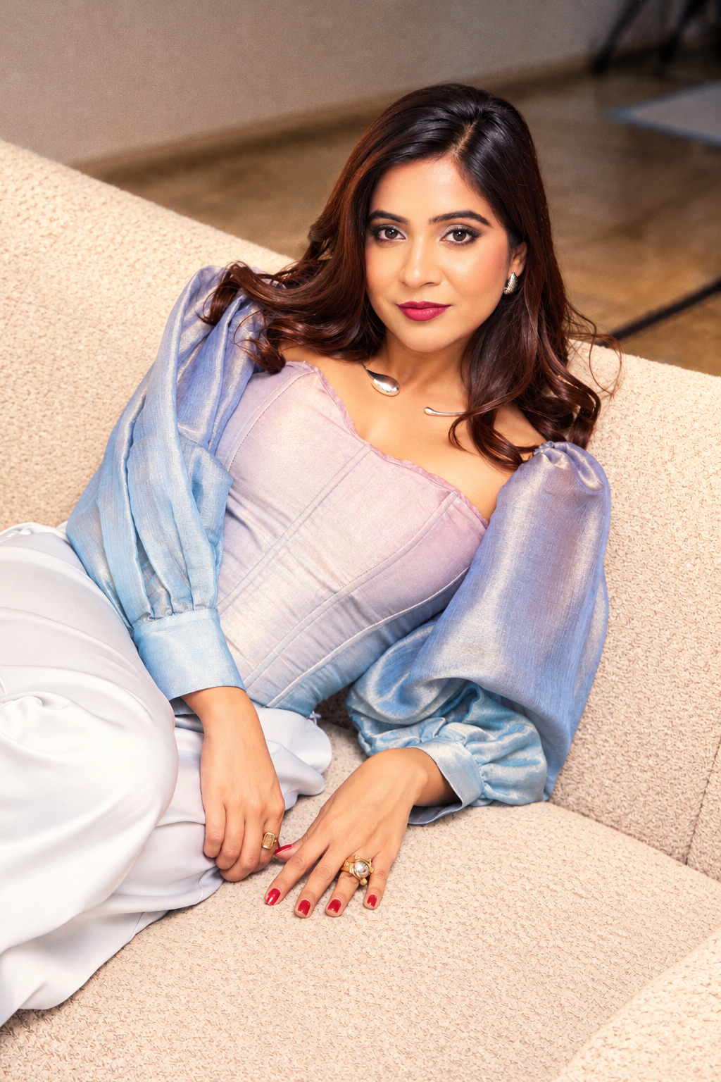 Woman wearing The Opaline Corset by Kashié, a pastel ombre organza silk corset top