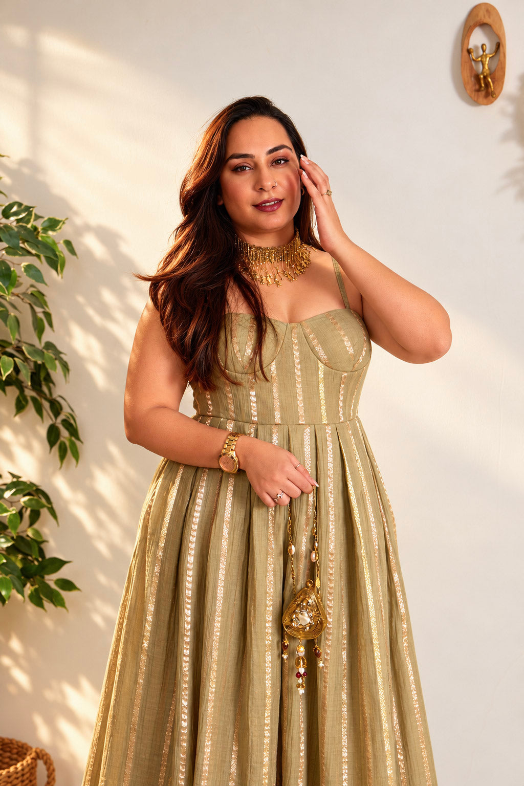 Woman styled in The Lumina Dress, a zari striped cotton silk dress, golden hour portrait
