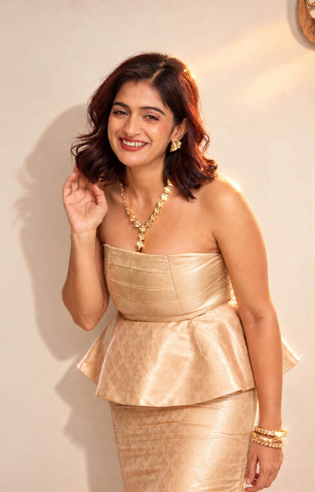 Woman wearing The Glacé Set by Kashié, a champagne silk brocade corset and skirt co-ord
