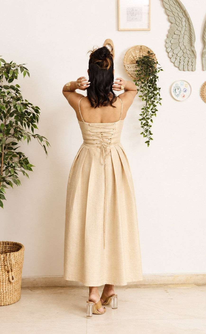 Blush pink silk corset dress with voluminous pleated midi skirt